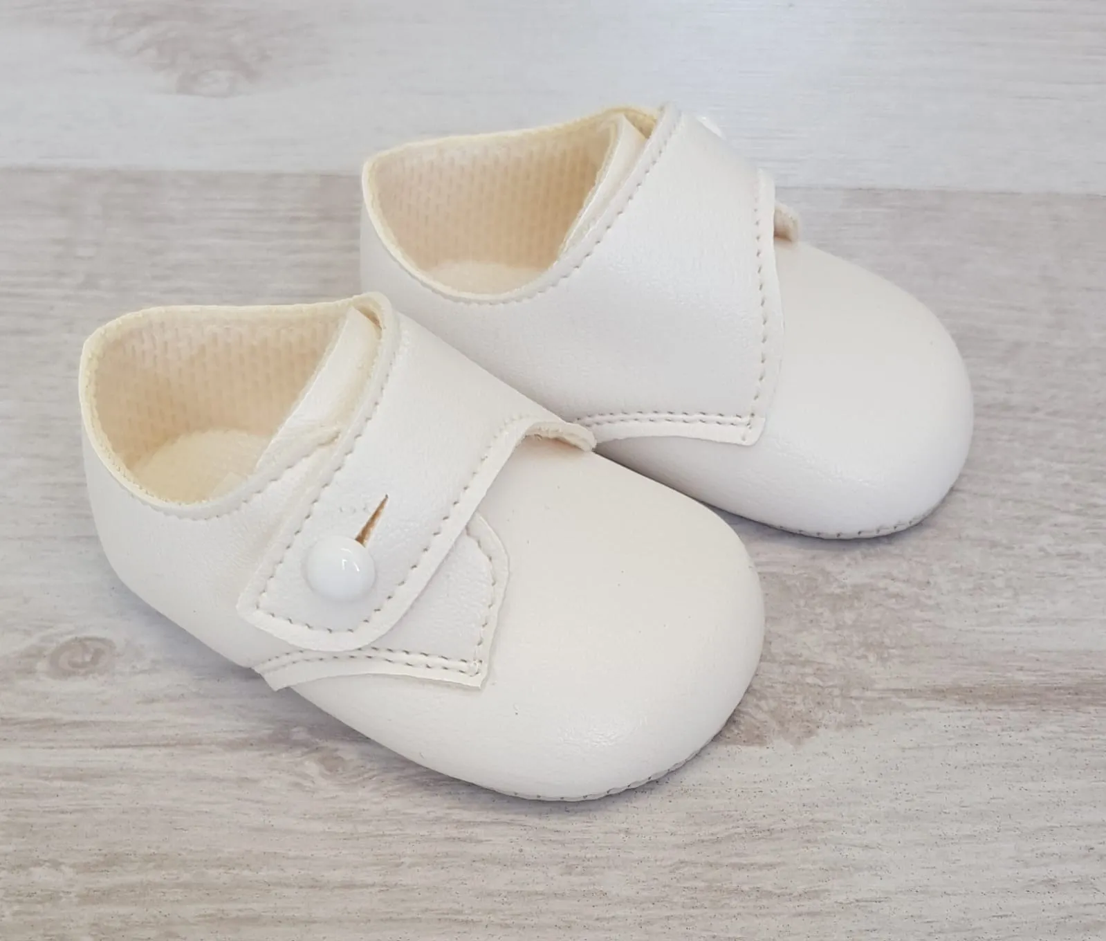 White matte button over soft sole shoes